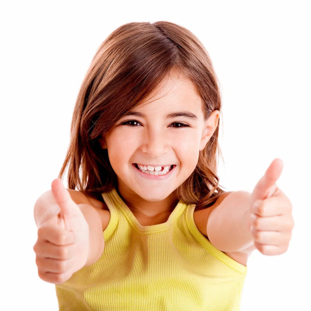 girl with smile and thumbs up: childrens dentist jupiter fl